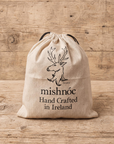 recycled cotton dustbag with drawstring for leather belt and accessories with mishnoc logo on the front and text Hand crafted in Ireland