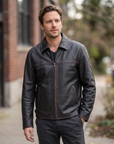 1847 black rubed off goat leather leather jacket with collar, zipped pockets and an adjustable waist cinch strap