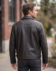1847 black rubed off goat leather leather jacket with collar, zipped pockets and an adjustable waist cinch strap