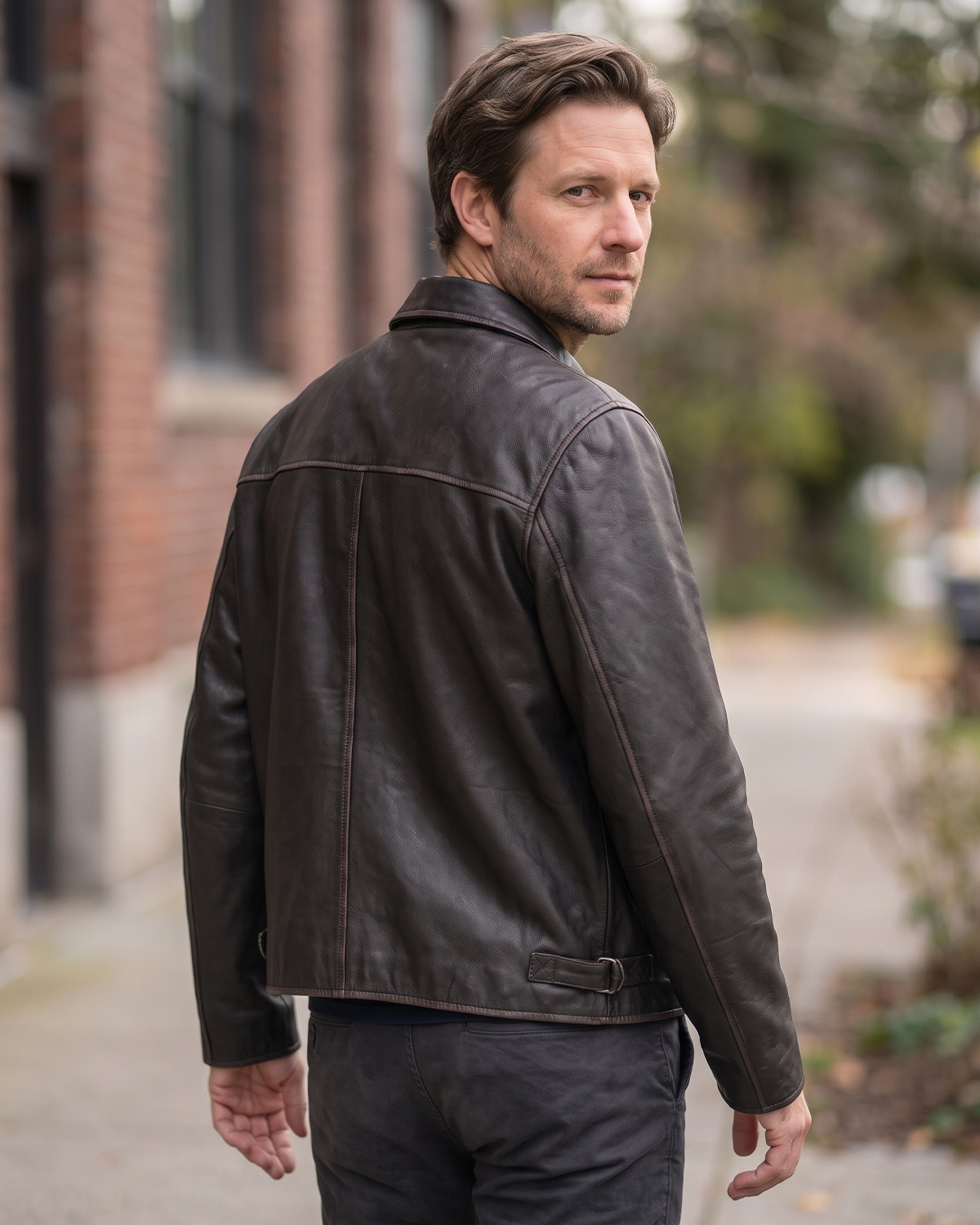 1847 black rubed off goat leather leather jacket with collar, zipped pockets and an adjustable waist cinch strap