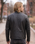 1847 black lamb nappa polish leather jacket with patterned shoulders, zipped pockets and an adjustable waist cinch strap