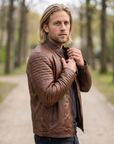 1847 copper brown lamb nappa polish leather jacket with patterned shoulders, zipped pockets and an adjustable waist cinch strap